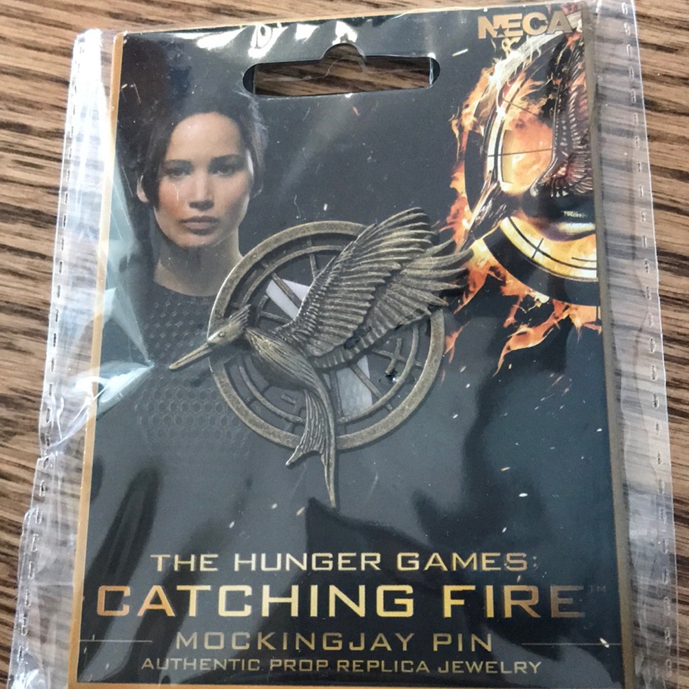 Catching fire mocking jay pin